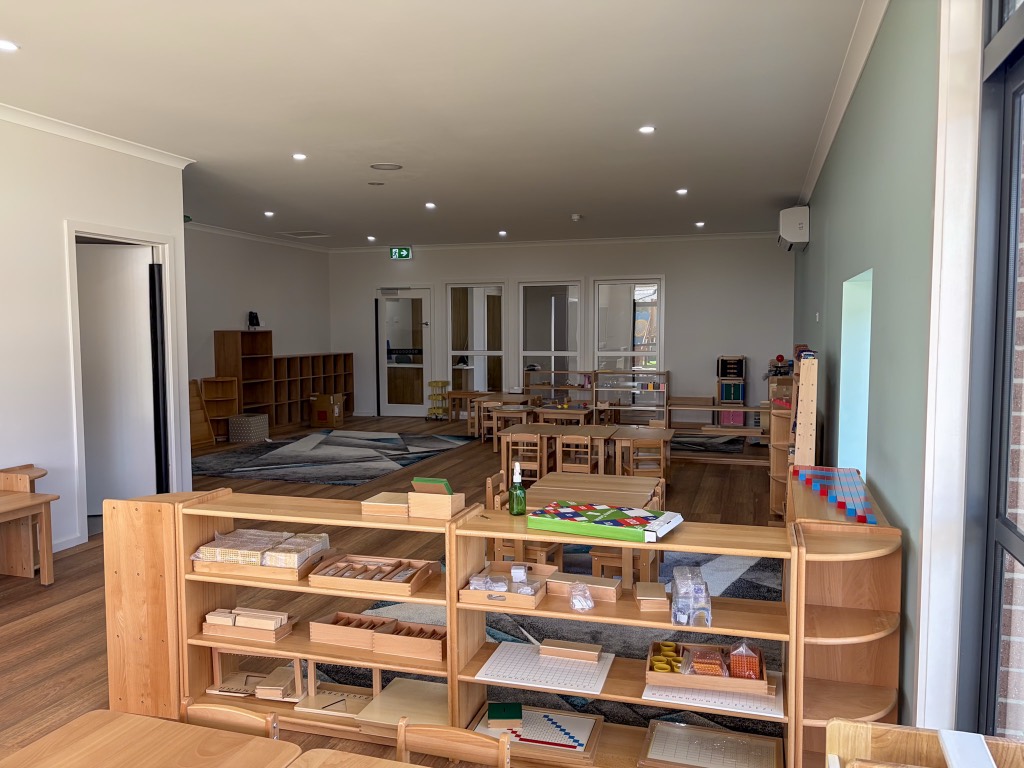 Montessori material shelves laid out in the Wyndham Vale kindergarten room