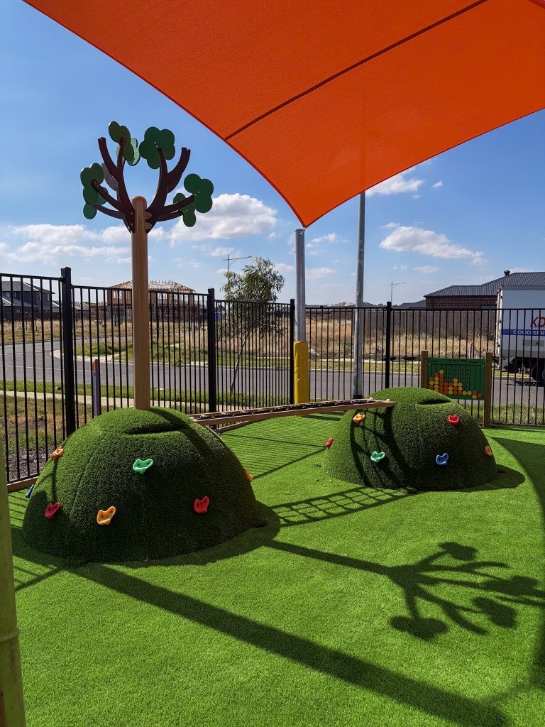 Climbing domes under shade sails in the Wyndham Vale outdoor play space