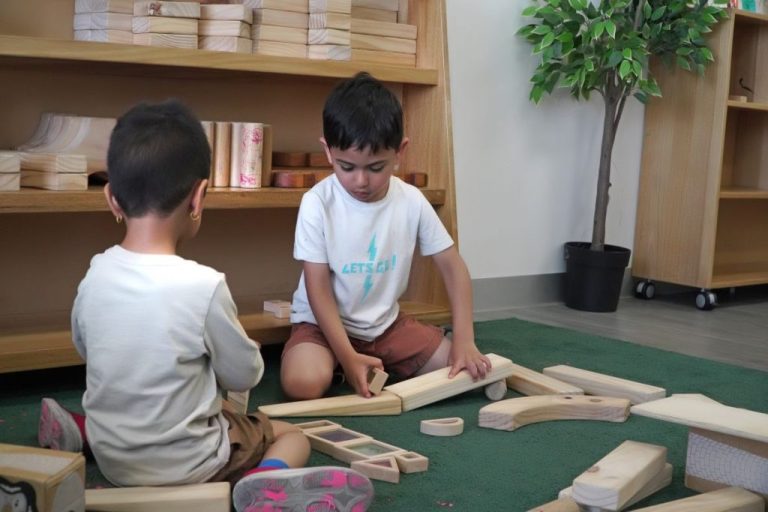 Children exploring learning materials together